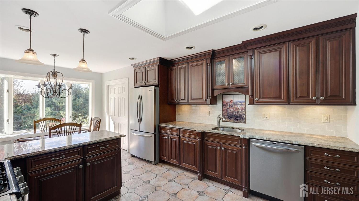 10 Bruning Road East Brunswick, NJ 08816 - Photo 11 of 40 a kitchen with a sink stove and refrigerator