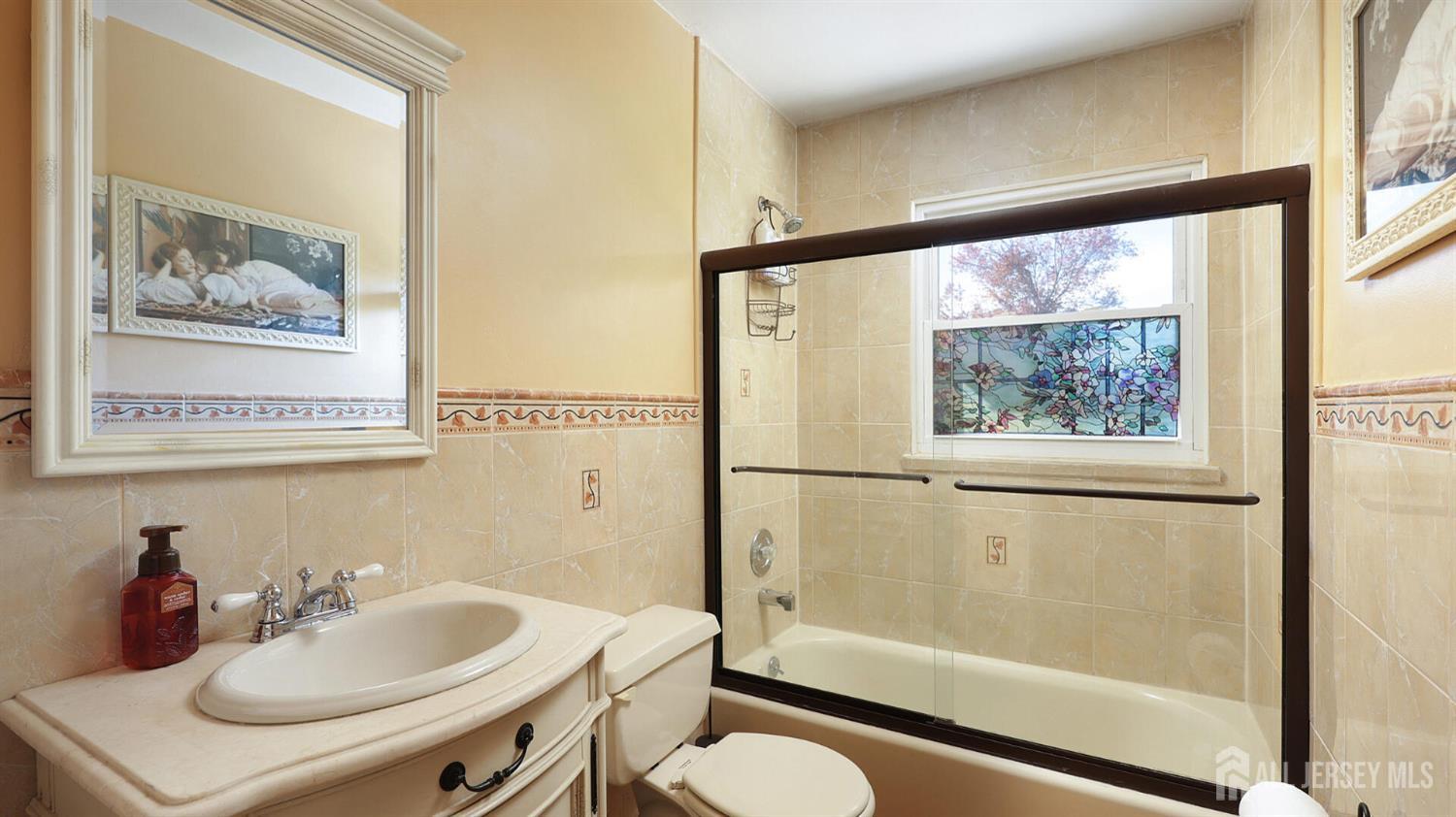 10 Bruning Road East Brunswick, NJ 08816 - Photo 28 of 40 a bathroom with a sink and a mirror