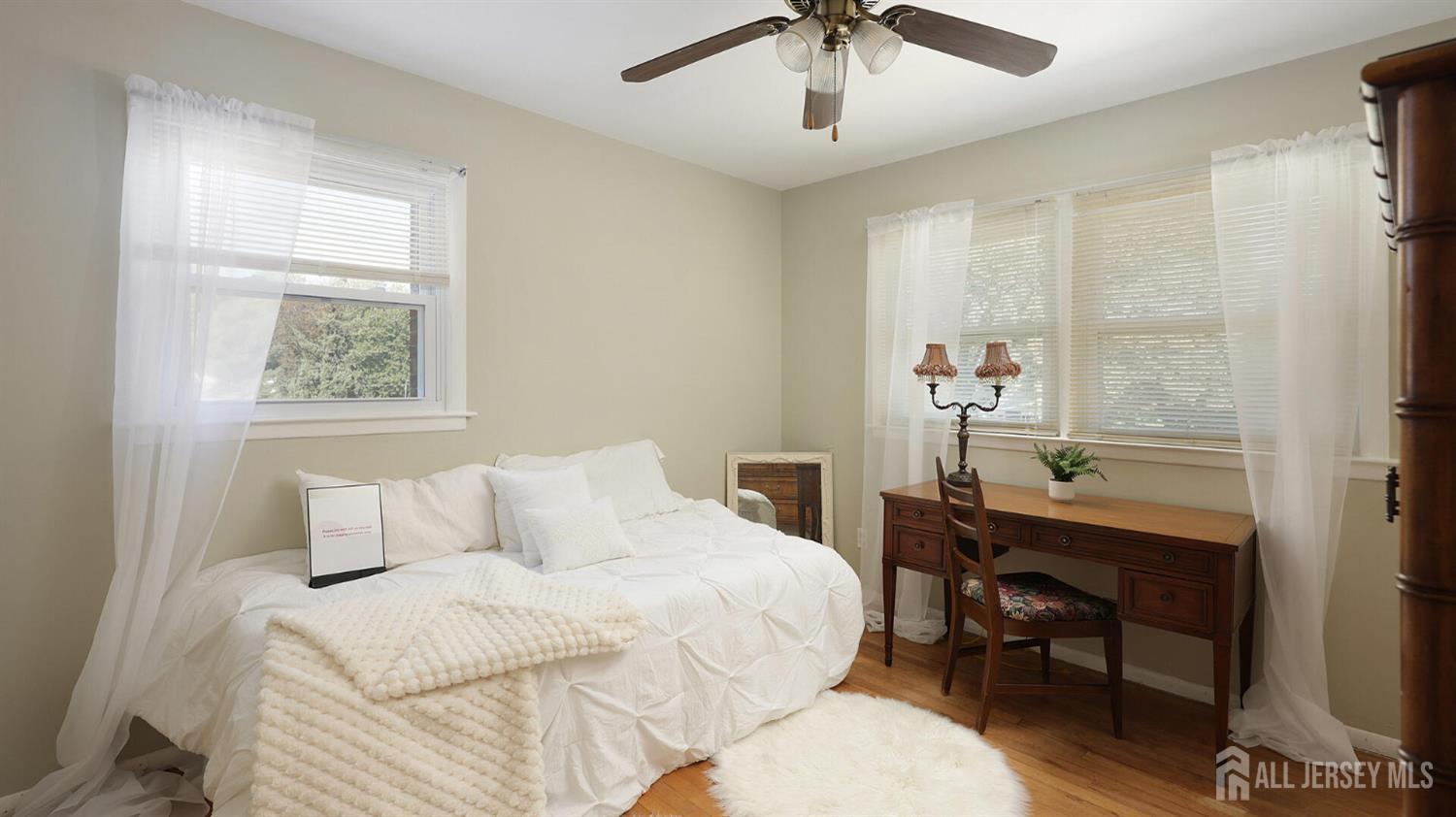10 Bruning Road East Brunswick, NJ 08816 - Photo 30 of 40 a bedroom with a bed and a table in it