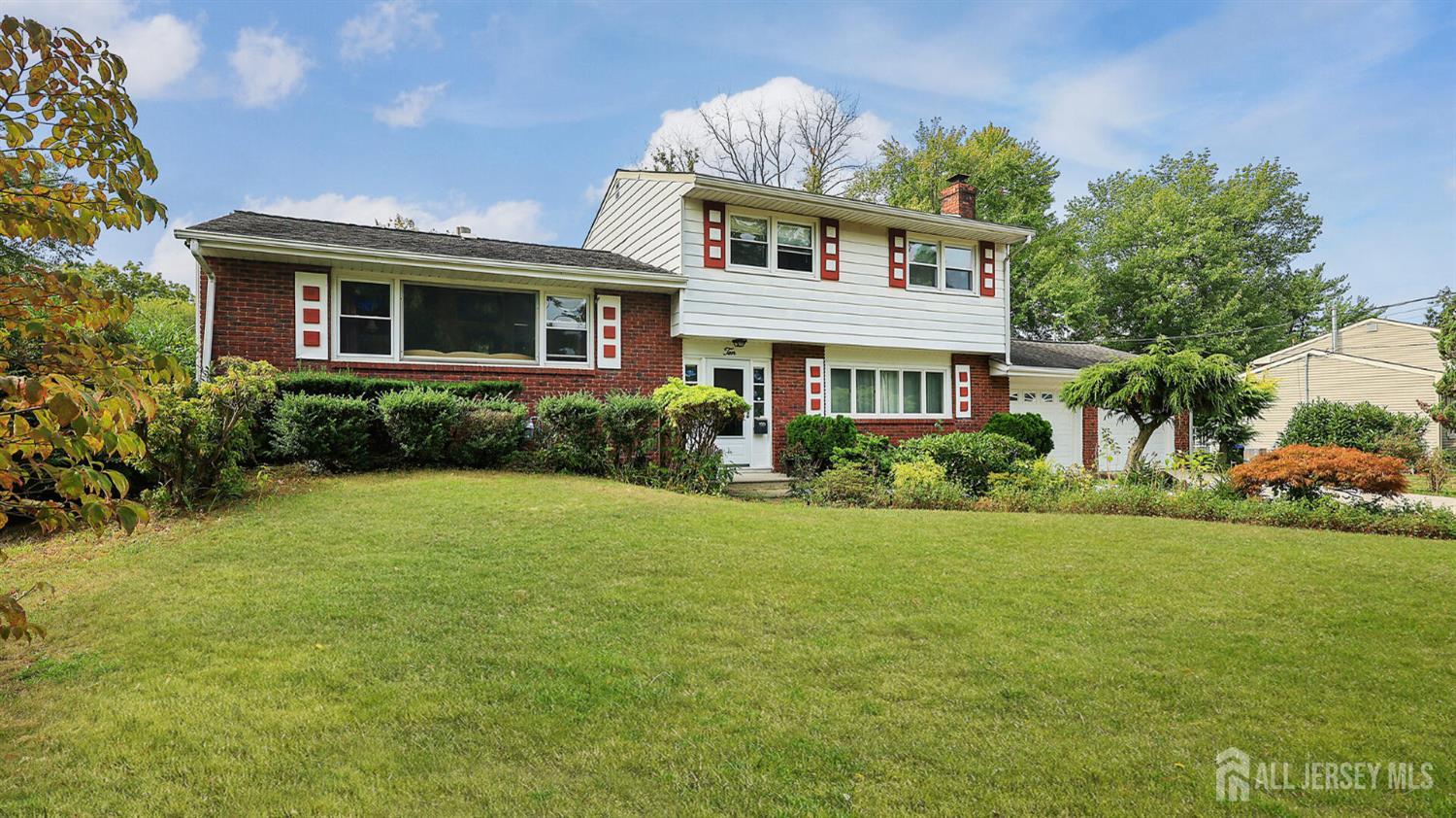 10 Bruning Road East Brunswick, NJ 08816 - Photo 3 of 40 a front view of a house with garden