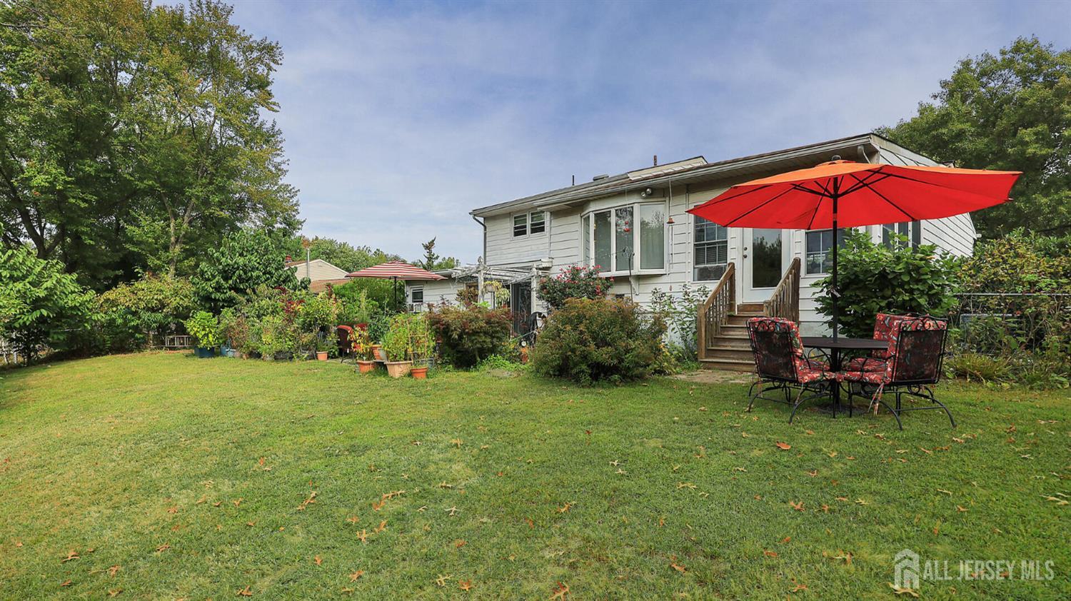10 Bruning Road East Brunswick, NJ 08816 - Photo 36 of 40 a view of a house with a yard porch and sitting area