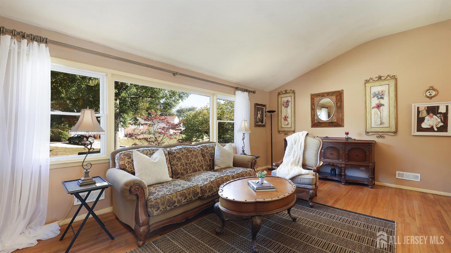 10 Bruning Road East Brunswick, NJ 08816 - Photo 7 of 40 a living room with furniture and a large window