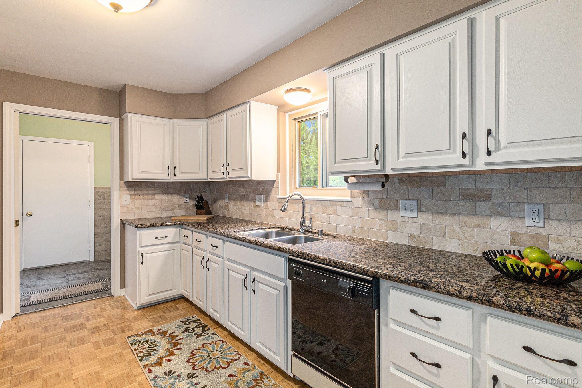 1746 Ridge Road White Lake, MI 48383 - Photo 12 of 39 View into Laundry Room with Door to Garage
