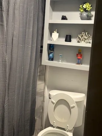 a bathroom with a toilet and a sink