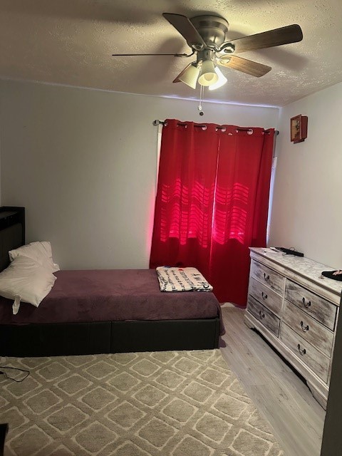 4303 Chestergate Drive Spring, TX 77373 - Photo 18 of 35 a bedroom with a bed and a dresser in it