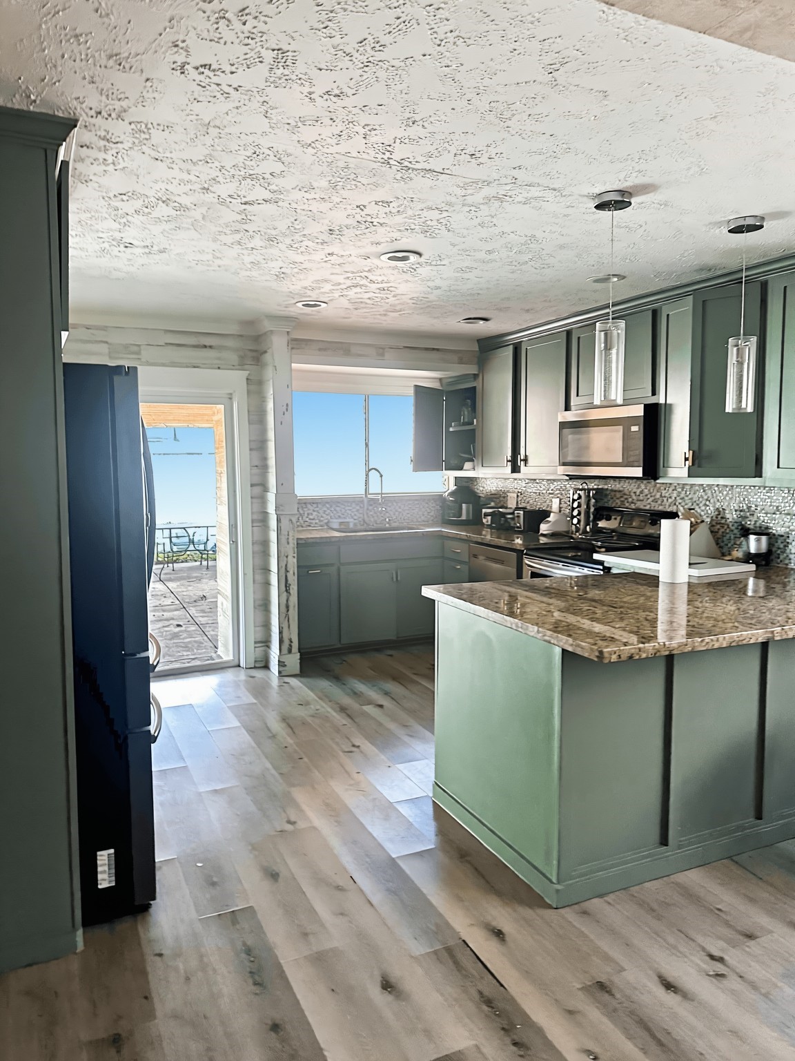 4303 Chestergate Drive Spring, TX 77373 - Photo 2 of 35 a kitchen with stainless steel appliances granite countertop a stove a sink and a refrigerator