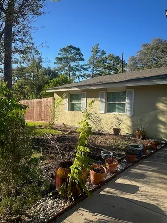 a front view of a house with garden