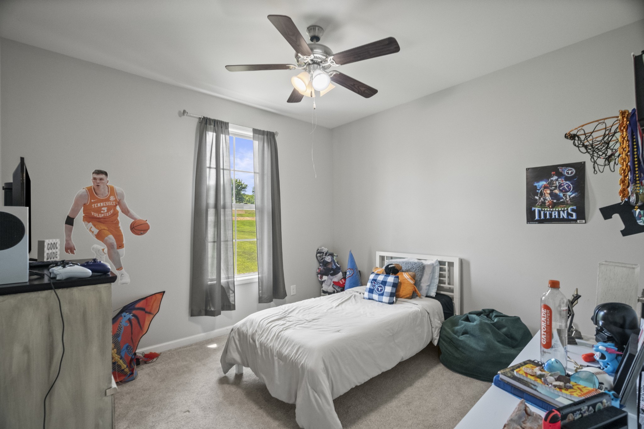 267 Aplin Branch Road Cottontown, TN 37048 - Photo 16 of 56 a bedroom with a bed and a chandelier