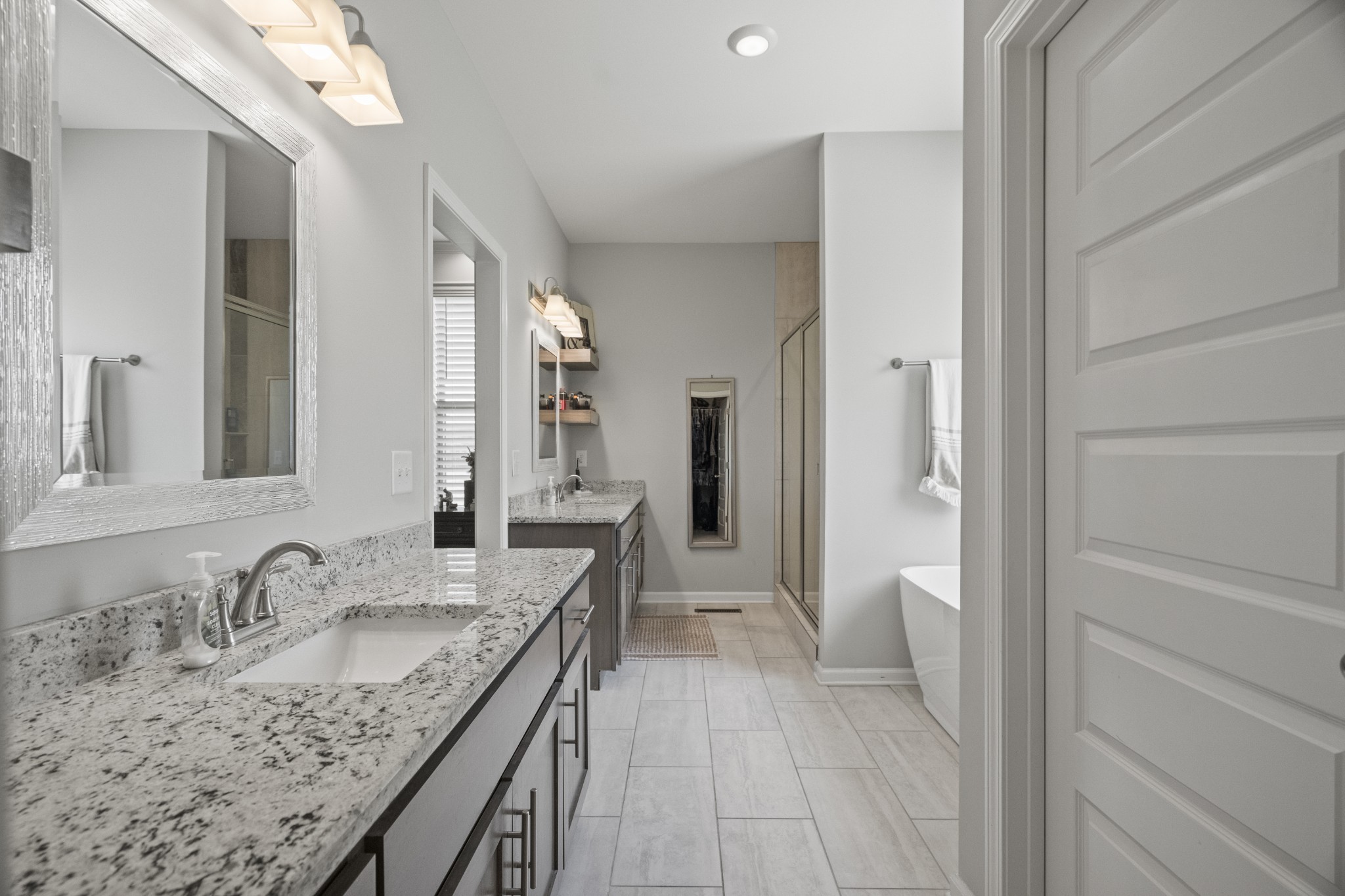 267 Aplin Branch Road Cottontown, TN 37048 - Photo 35 of 56 a bathroom with a granite countertop sink and a mirror