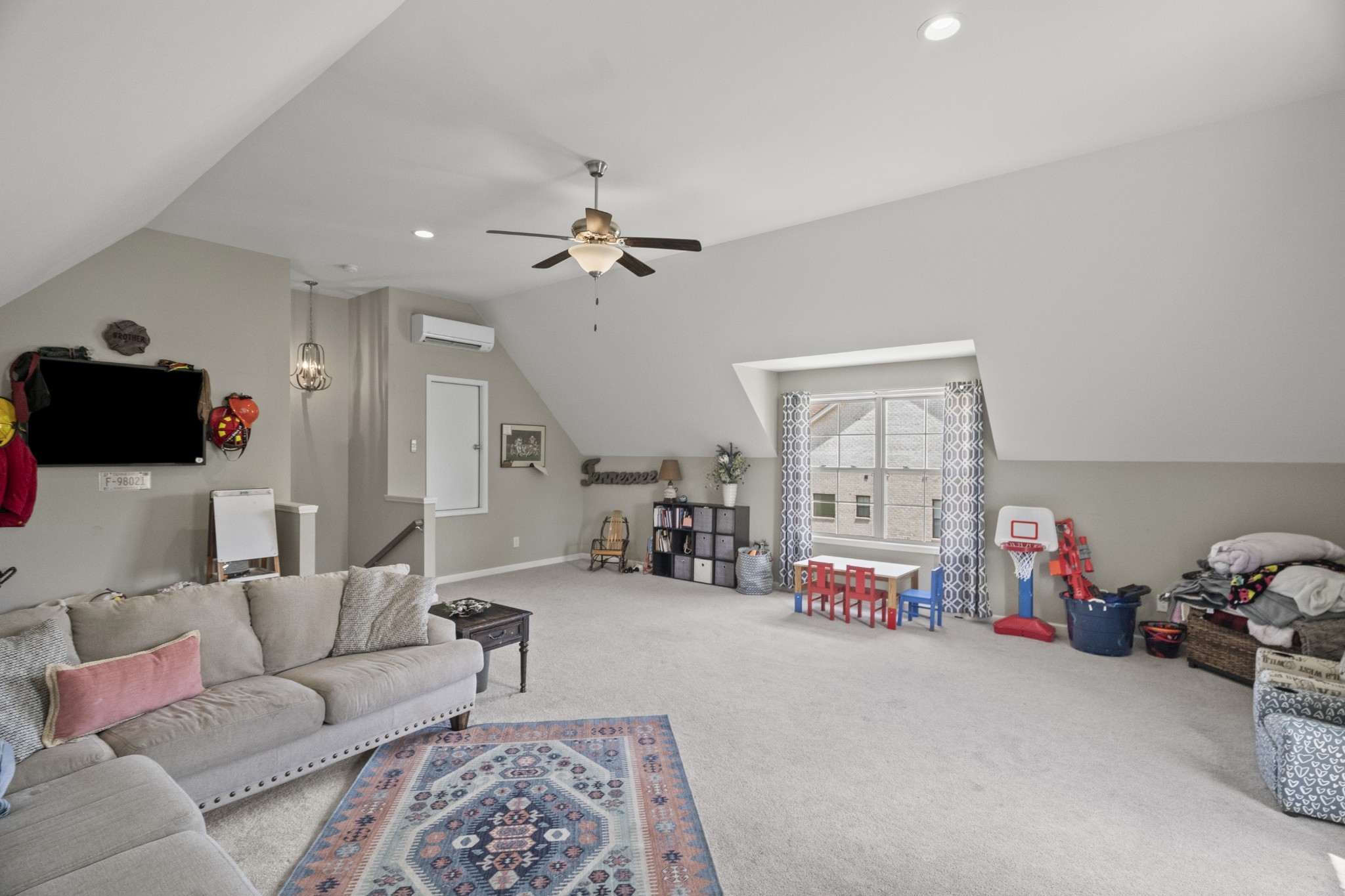 267 Aplin Branch Road Cottontown, TN 37048 - Photo 38 of 56 a living room with furniture a air conditioner vent and a window