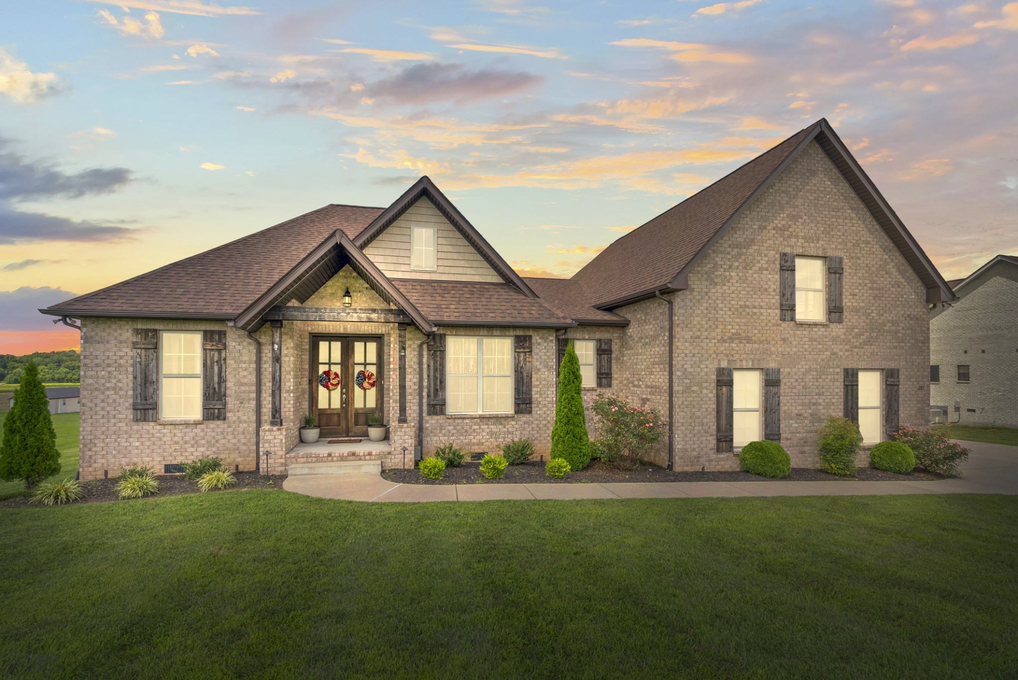 267 Aplin Branch Road Cottontown, TN 37048 - Photo 4 of 56 a front view of a house with a yard and green space