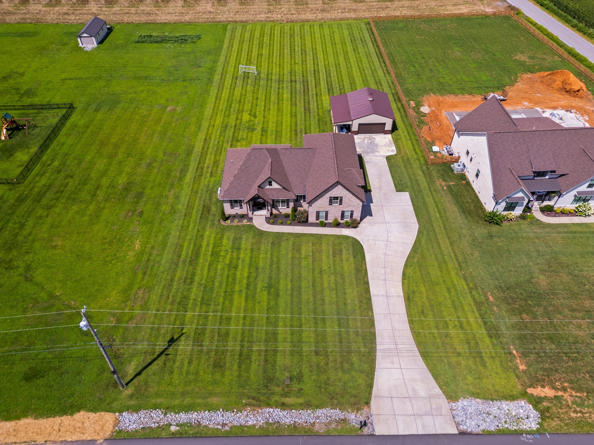 267 Aplin Branch Road Cottontown, TN 37048 - Photo 49 of 56 an aerial view of a house with a garden and swimming pool