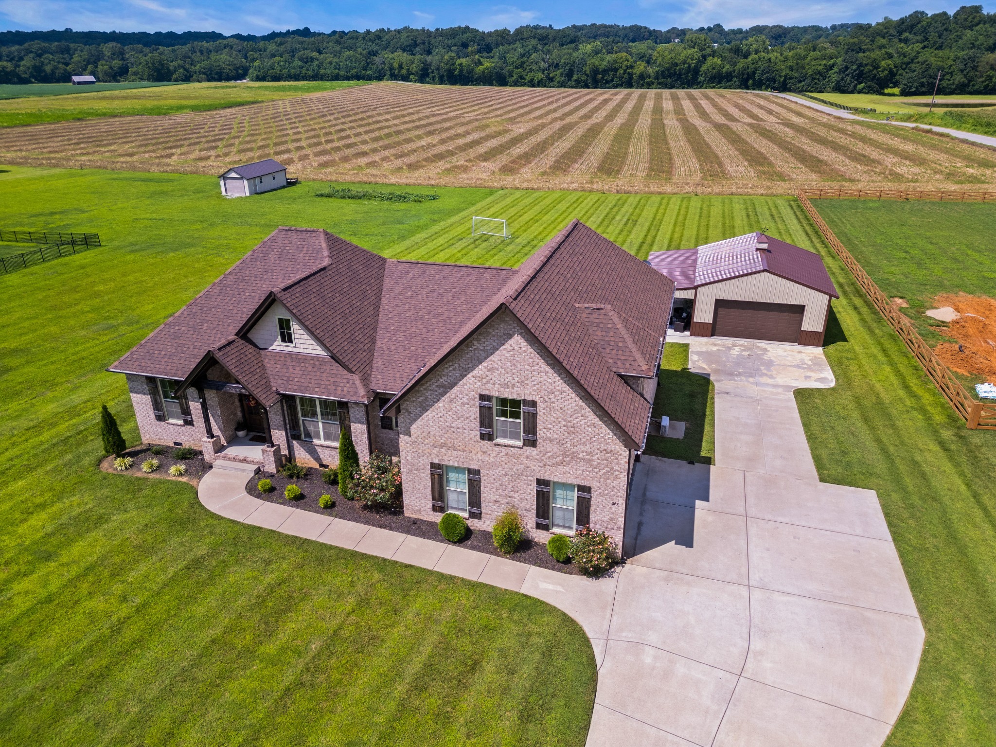 267 Aplin Branch Road Cottontown, TN 37048 - Photo 50 of 56 a aerial view of a house with swimming pool and a yard