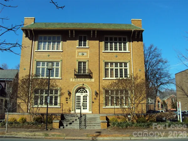 a front view of a building with street view