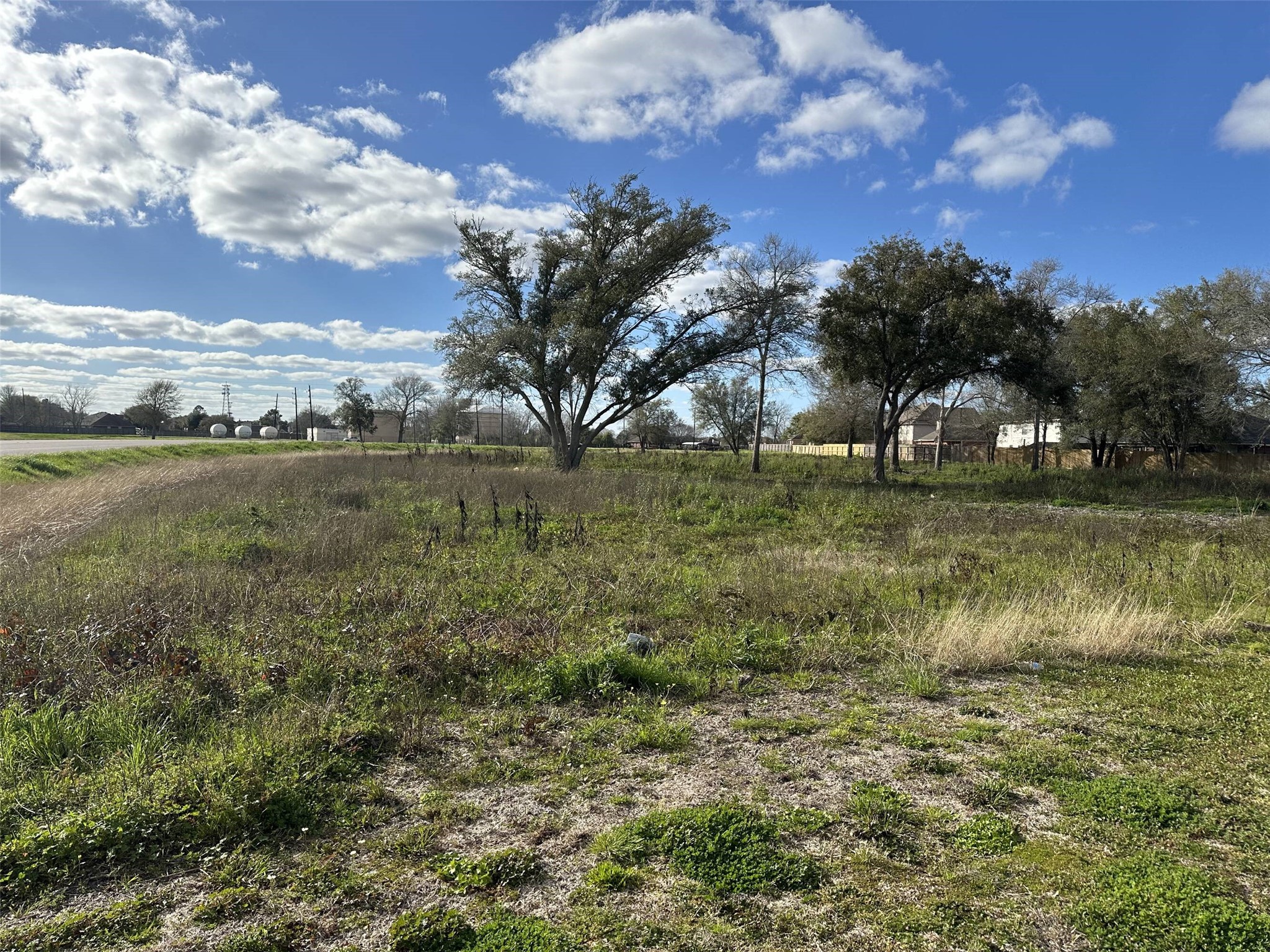 0 West Sycamore Road Fresno, TX 77545 - Photo 2 of 4 a view of a lake with houses in the back