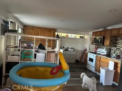 a room with furniture and flat screen tv