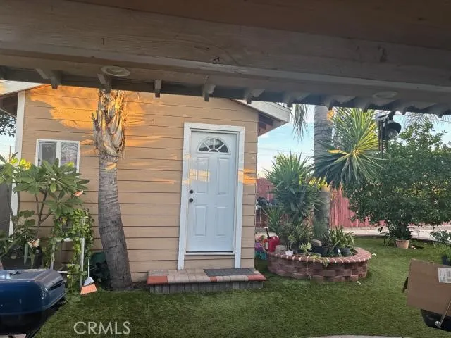 a front view of a house with a garden