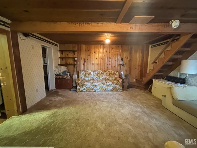 a view of a room with lots of gym equipment