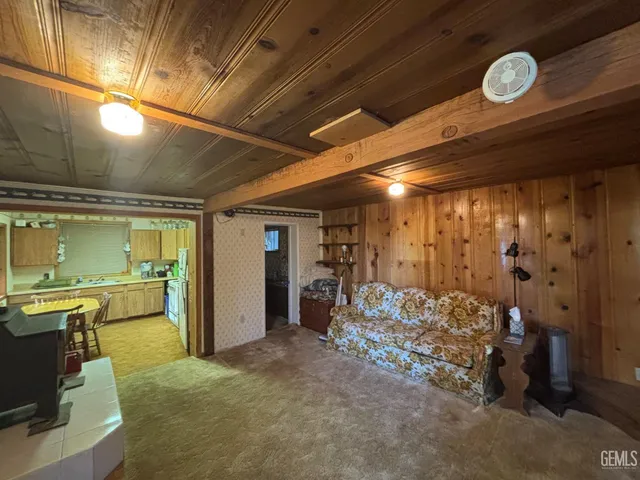 a view of a hallway with kitchen