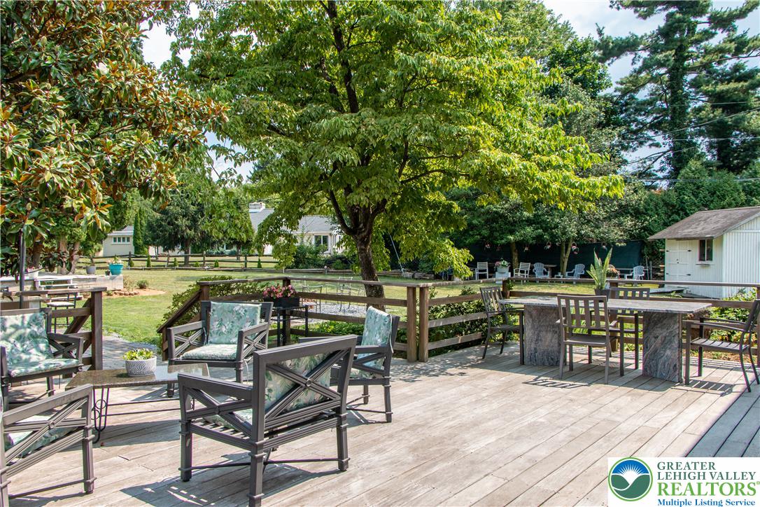 3582 Country Club Road Easton, PA 18045 - Photo 41 of 48 A spacious wooden deck provides ample outdoor living space, overlooking a lush, tree lined yard