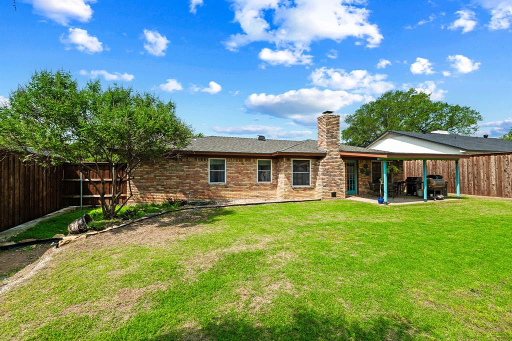 224 Overcrest Drive Benbrook, TX 76126 - Photo 32 of 39 a front view of house with a garden