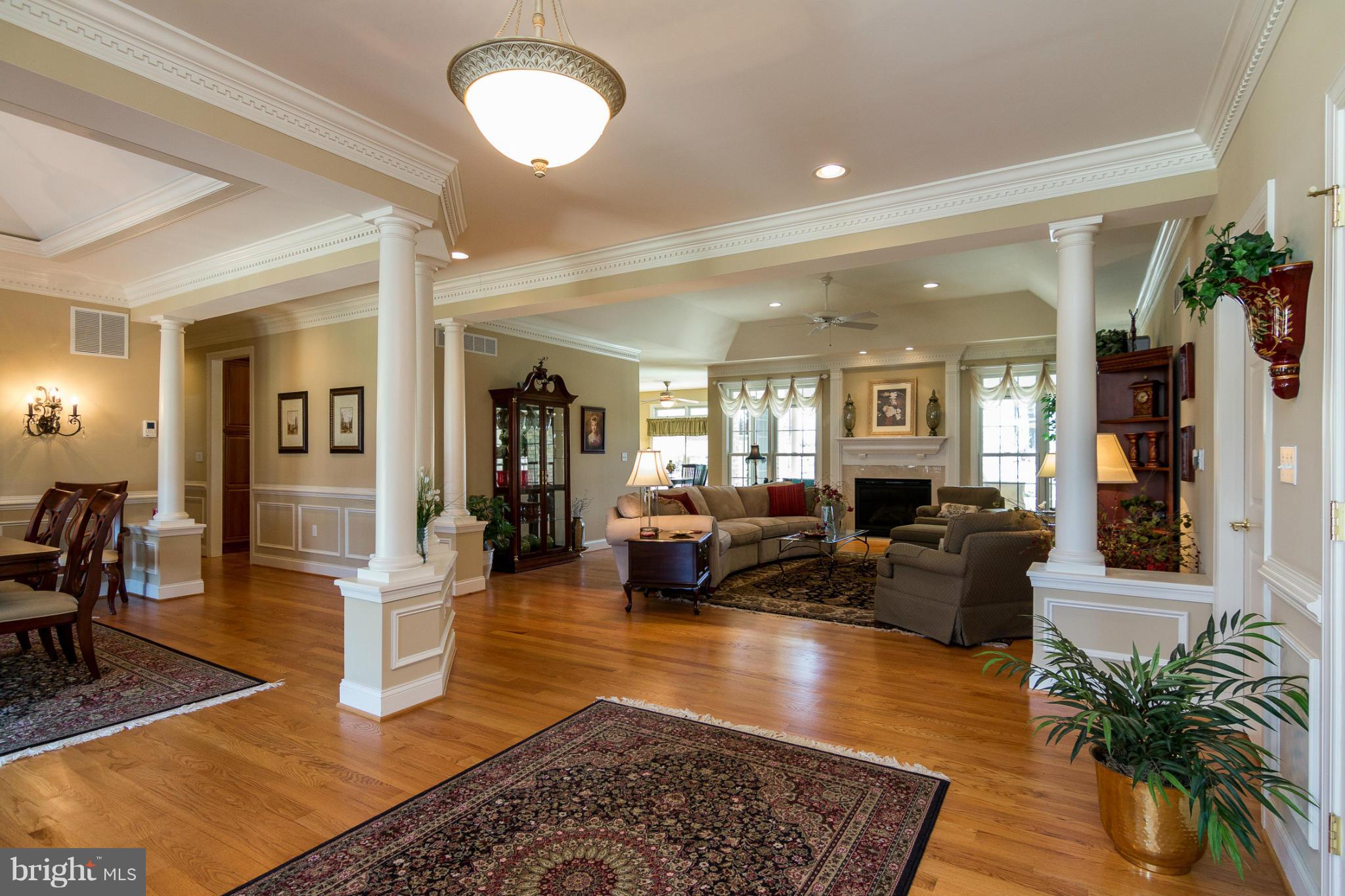 781 Lone Tree Road Westminster, MD 21157 - Photo 2 of 30 a living room with furniture hard wood floor and a table