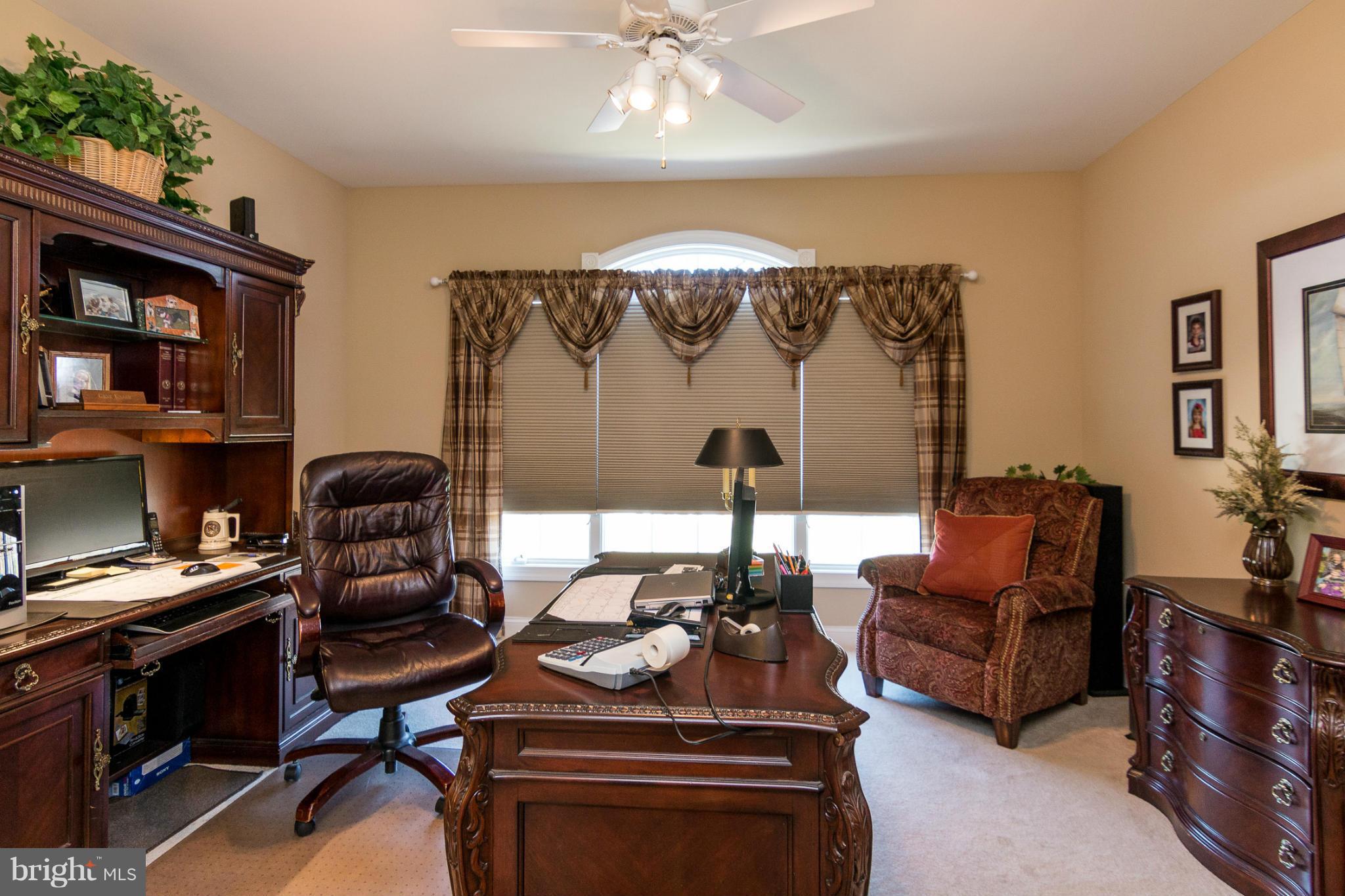 781 Lone Tree Road Westminster, MD 21157 - Photo 11 of 30 a living room with furniture and a chandelier