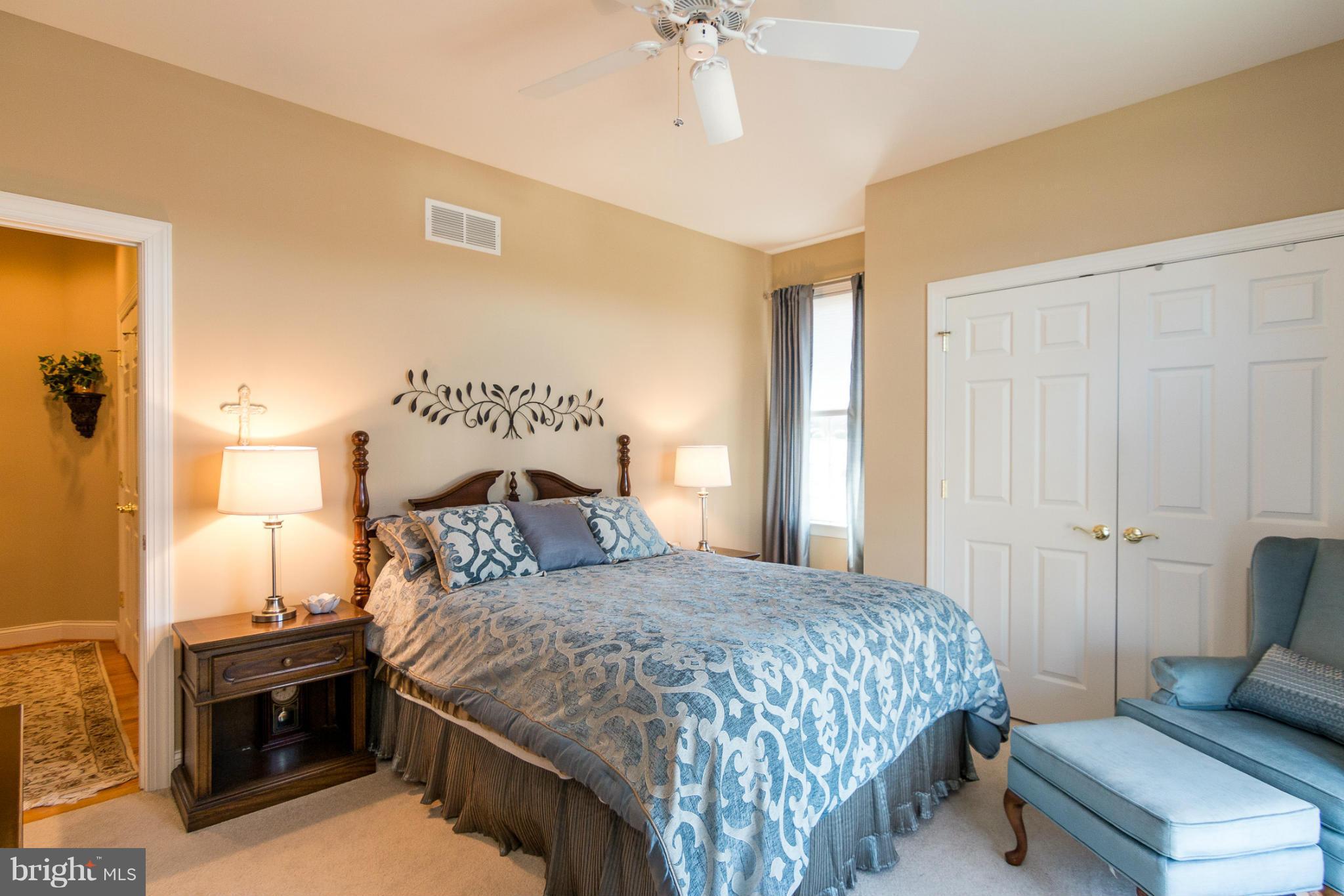 781 Lone Tree Road Westminster, MD 21157 - Photo 19 of 30 a bedroom with a bed and a chandelier