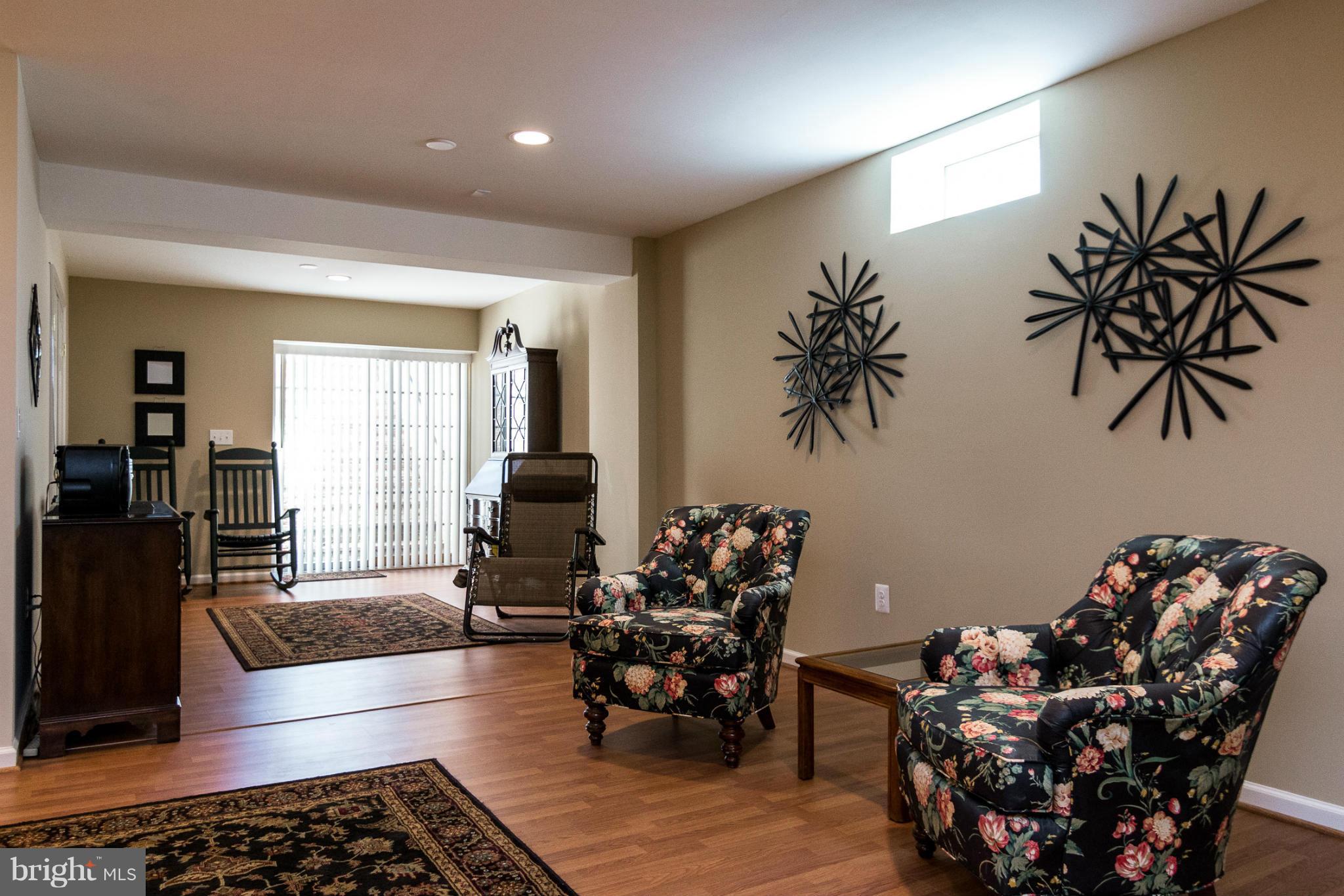 781 Lone Tree Road Westminster, MD 21157 - Photo 24 of 30 a living room with furniture and a potted plant