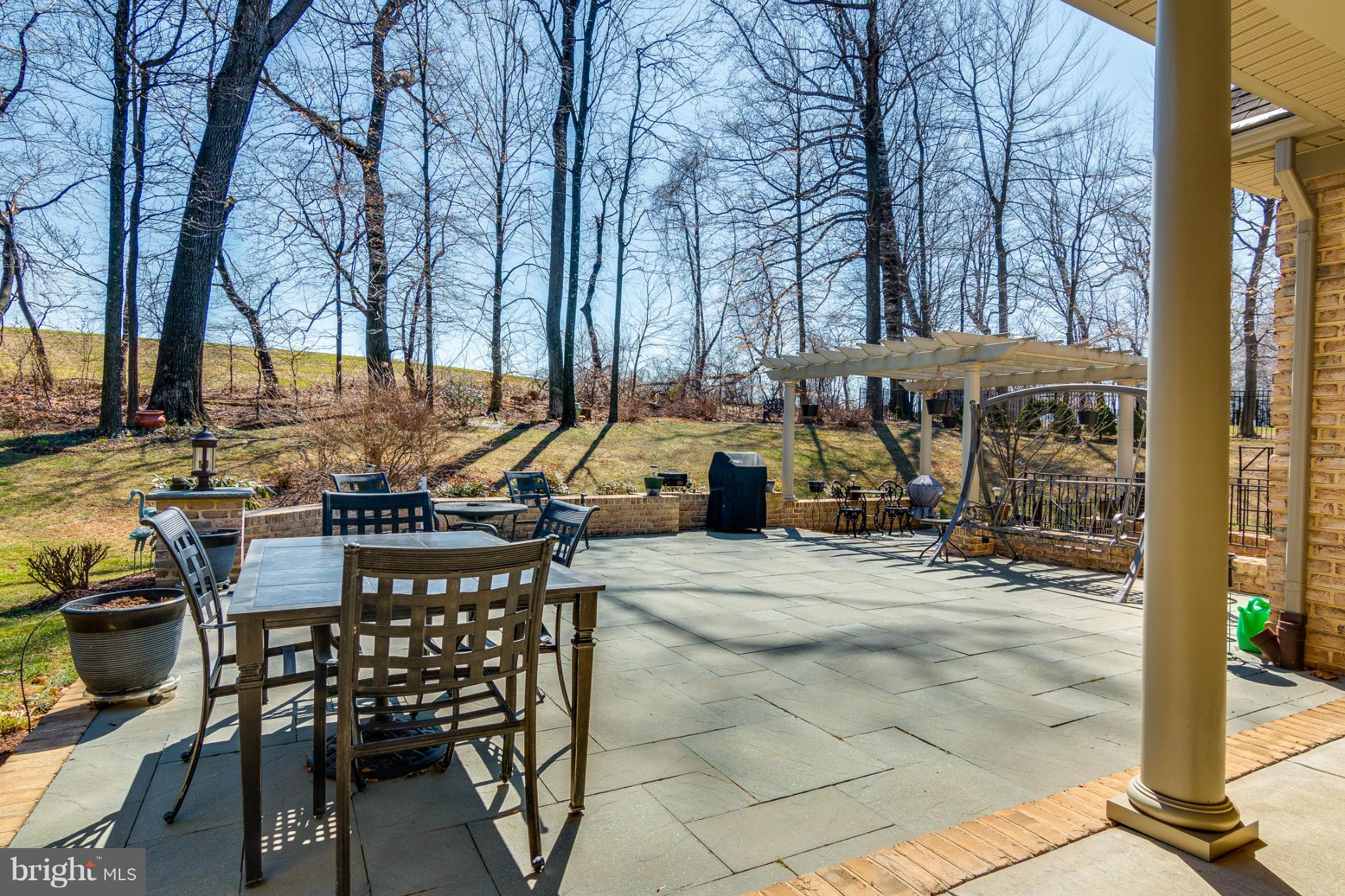 781 Lone Tree Road Westminster, MD 21157 - Photo 29 of 30 a view of a patio with table and chairs and potted plants