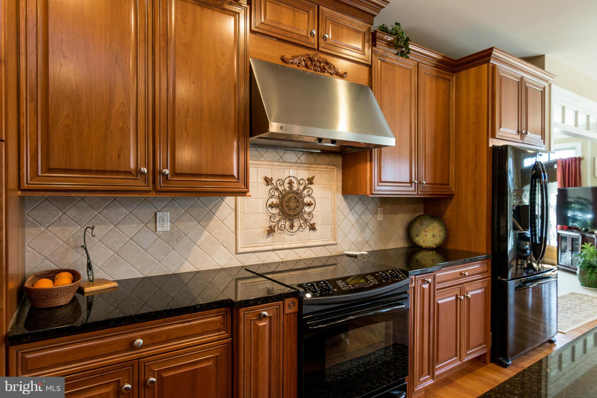 781 Lone Tree Road Westminster, MD 21157 - Photo 5 of 30 a kitchen with stainless steel appliances granite countertop a stove and a refrigerator