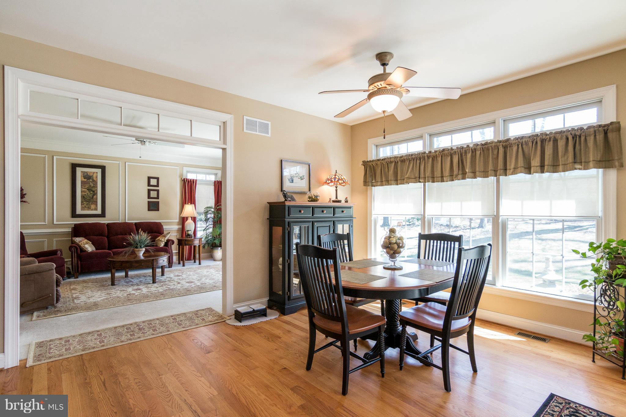 781 Lone Tree Road Westminster, MD 21157 - Photo 8 of 30 a view of a dining room with furniture window and wooden floor