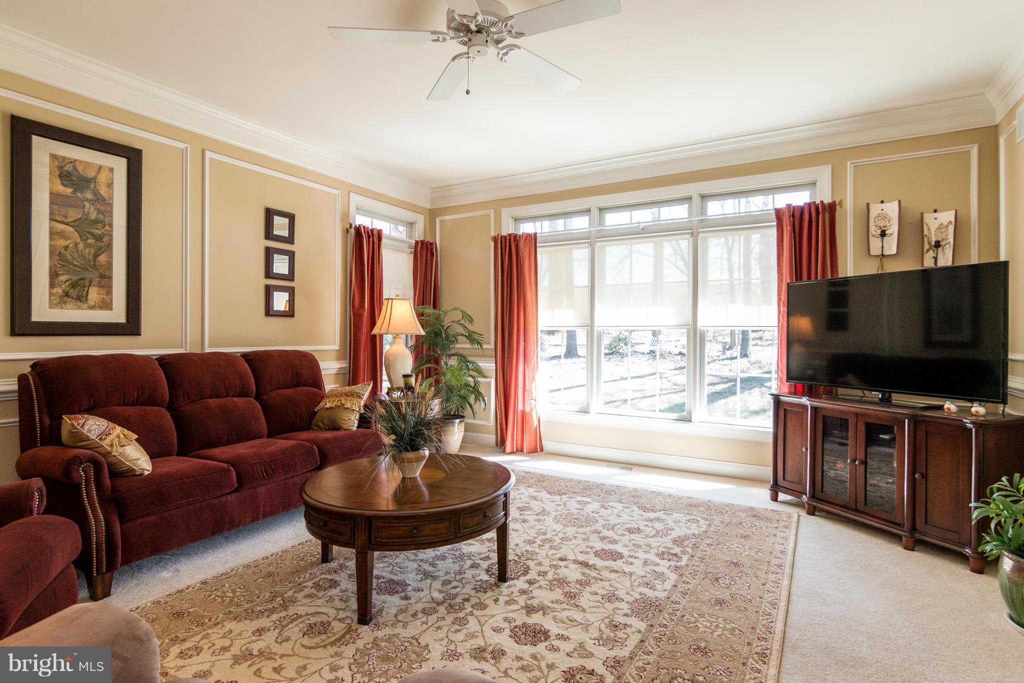 781 Lone Tree Road Westminster, MD 21157 - Photo 10 of 30 a living room with furniture and a flat screen tv