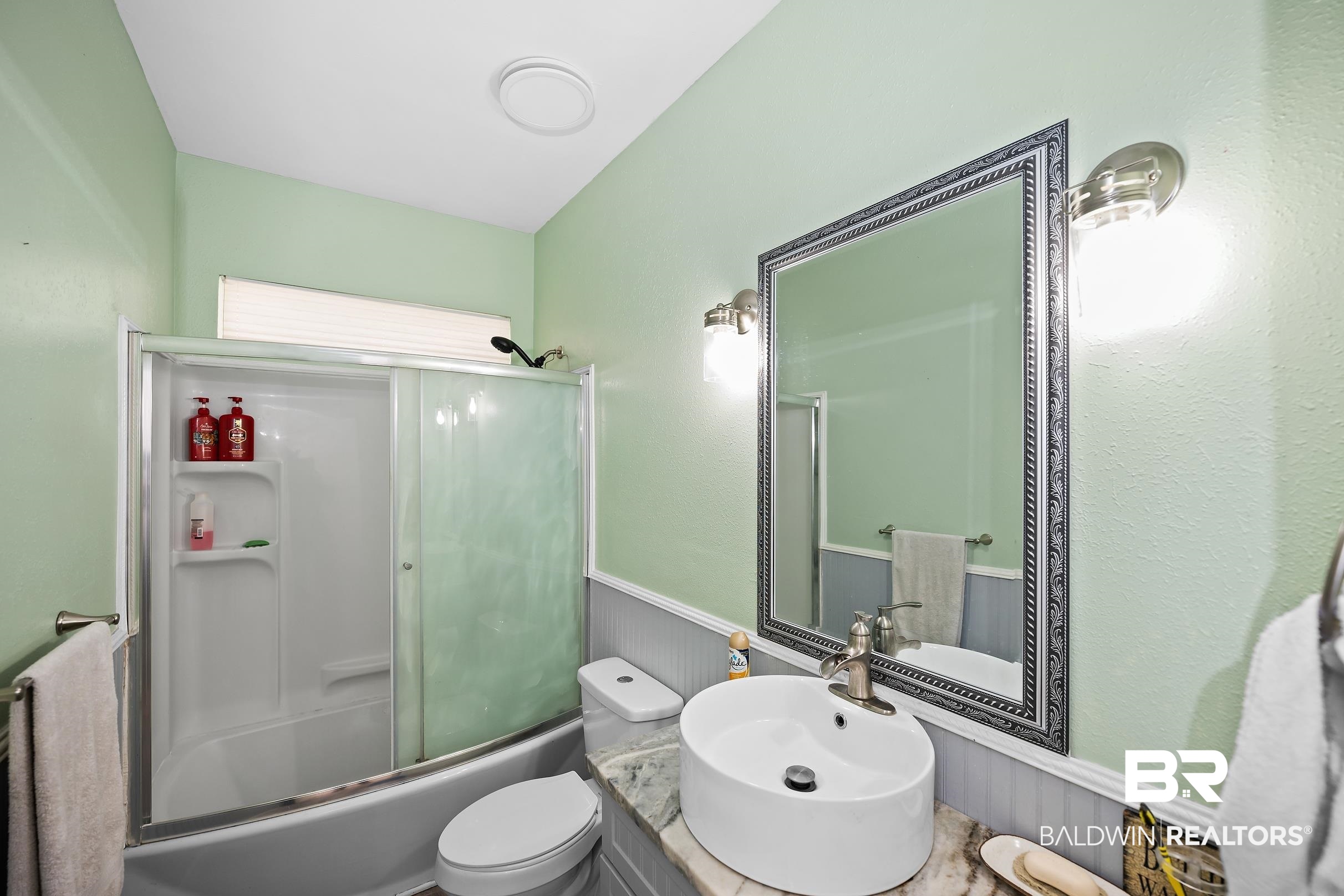 2674 Pine Ridge Drive Lillian, AL 36549 - Photo 17 of 42 Full bathroom featuring wainscoting, combined bath / shower with glass door, and vanity