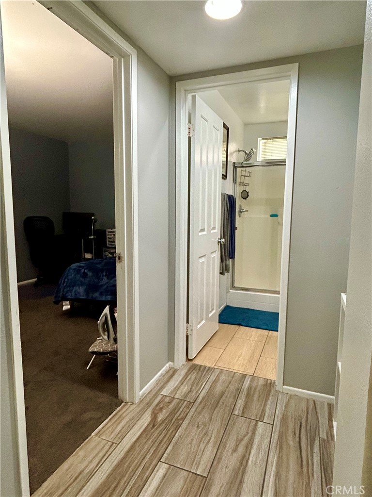 567 Botan Street Perris, CA 92571 - Photo 16 of 38 a bathroom with a glass door shower and a mirror