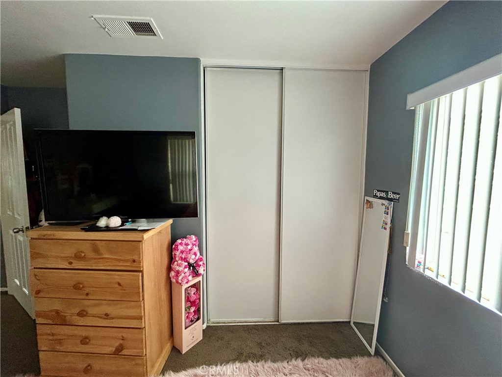 567 Botan Street Perris, CA 92571 - Photo 24 of 38 a room with storage and utility