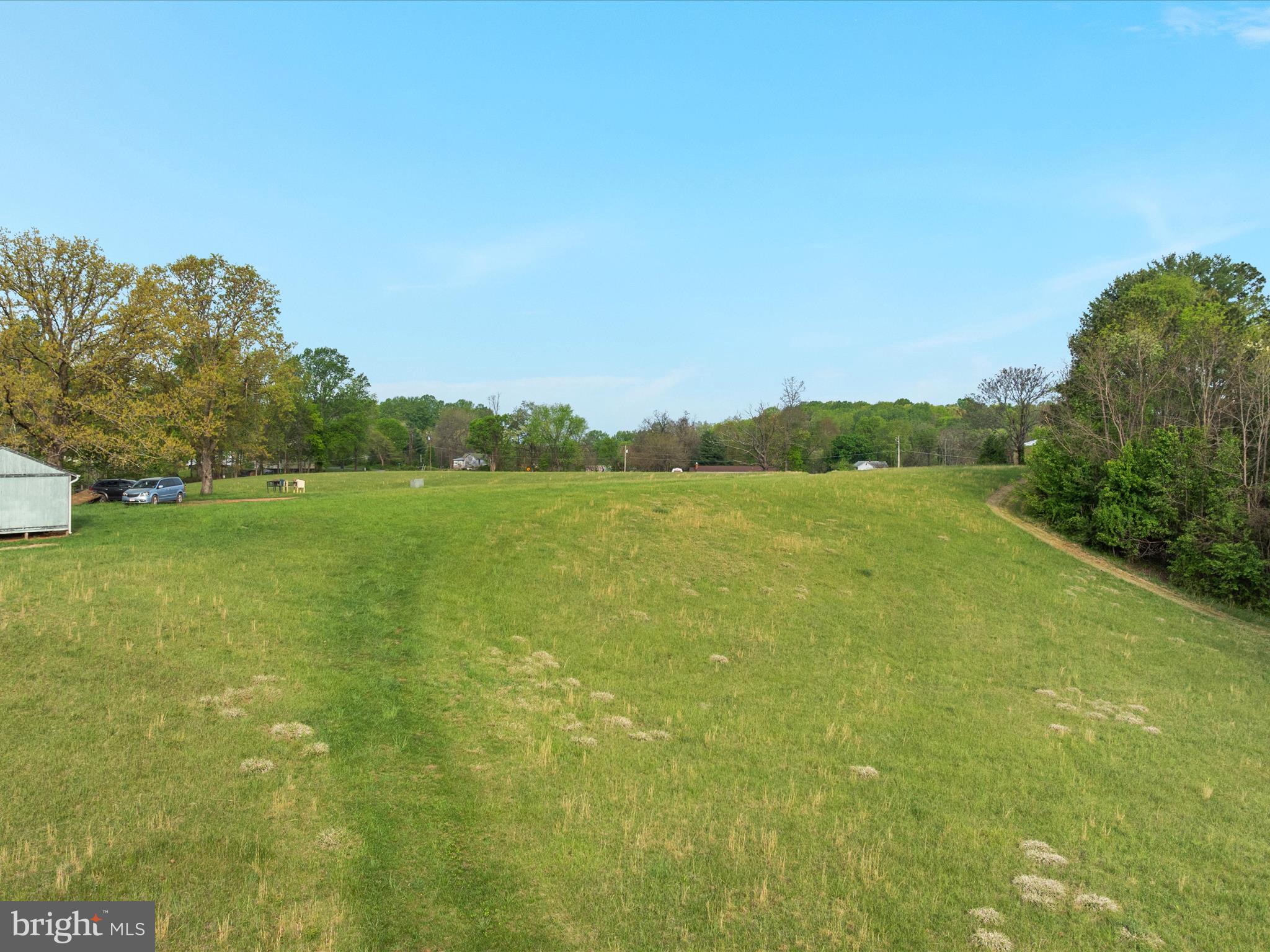 31-92e Jamesons Mill Road Culpeper, VA 22701 - Photo 10 of 16 a view of a lake with a big yard