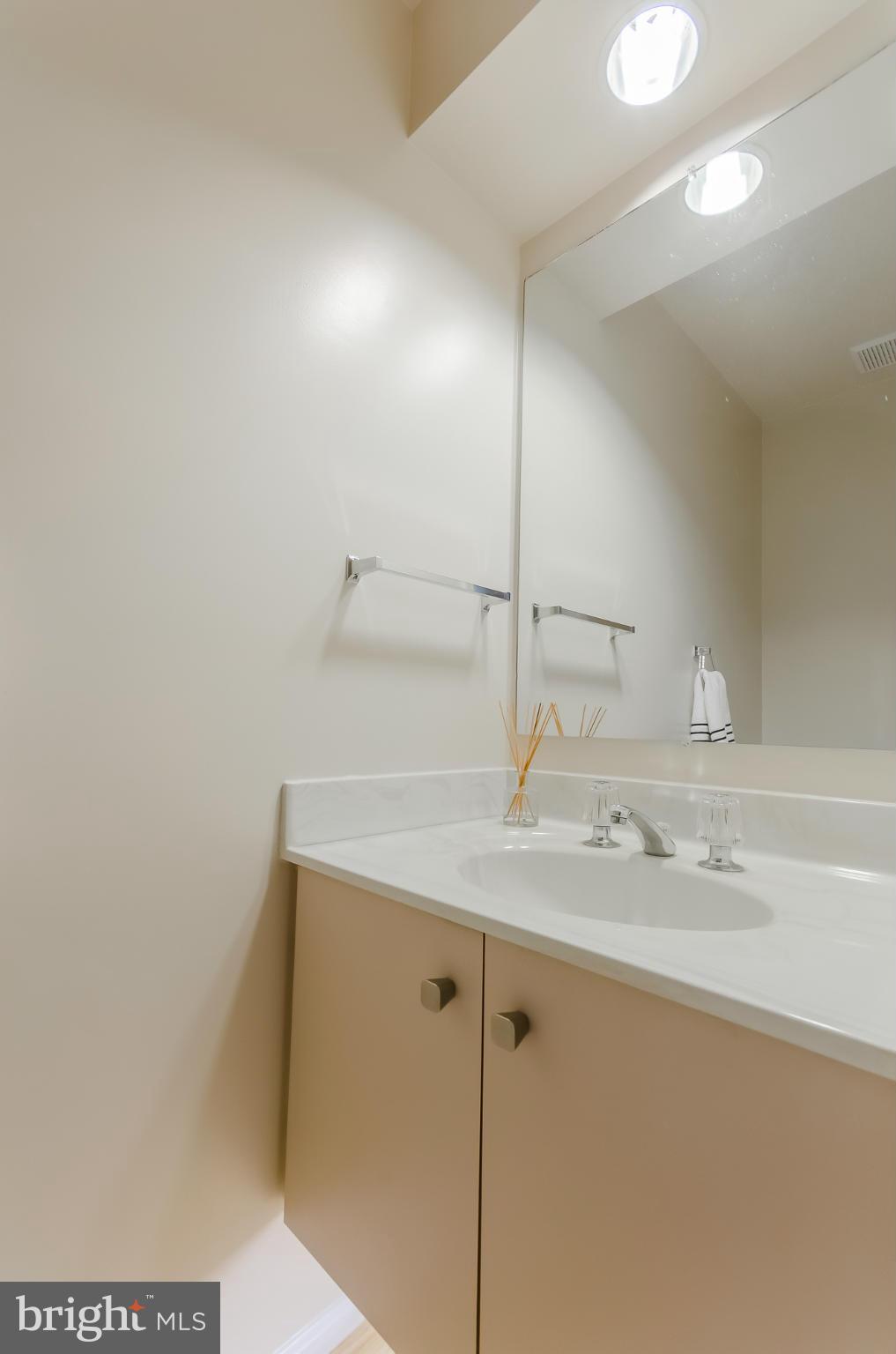 728 West Glebe Road Alexandria, VA 22305 - Photo 10 of 28 a bathroom with a sink and mirror