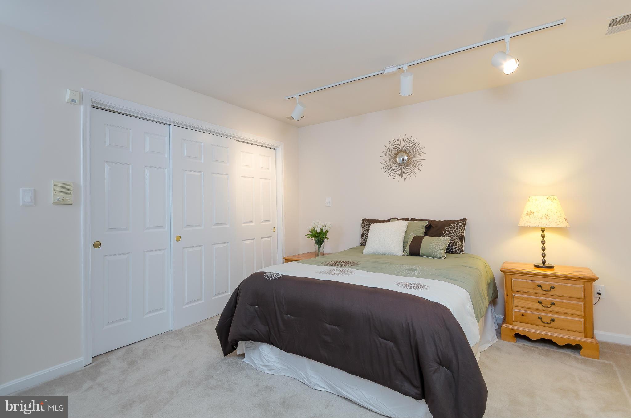 728 West Glebe Road Alexandria, VA 22305 - Photo 18 of 28 a bedroom with a bed and a night stand