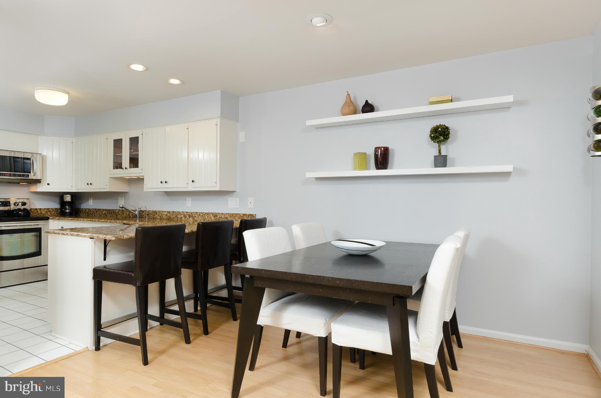 728 West Glebe Road Alexandria, VA 22305 - Photo 28 of 28 a kitchen with a table and chairs in it