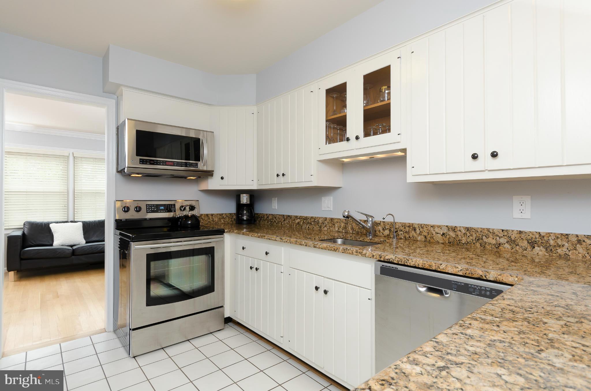 728 West Glebe Road Alexandria, VA 22305 - Photo 4 of 28 a kitchen with granite countertop white cabinets stainless steel appliances and a sink
