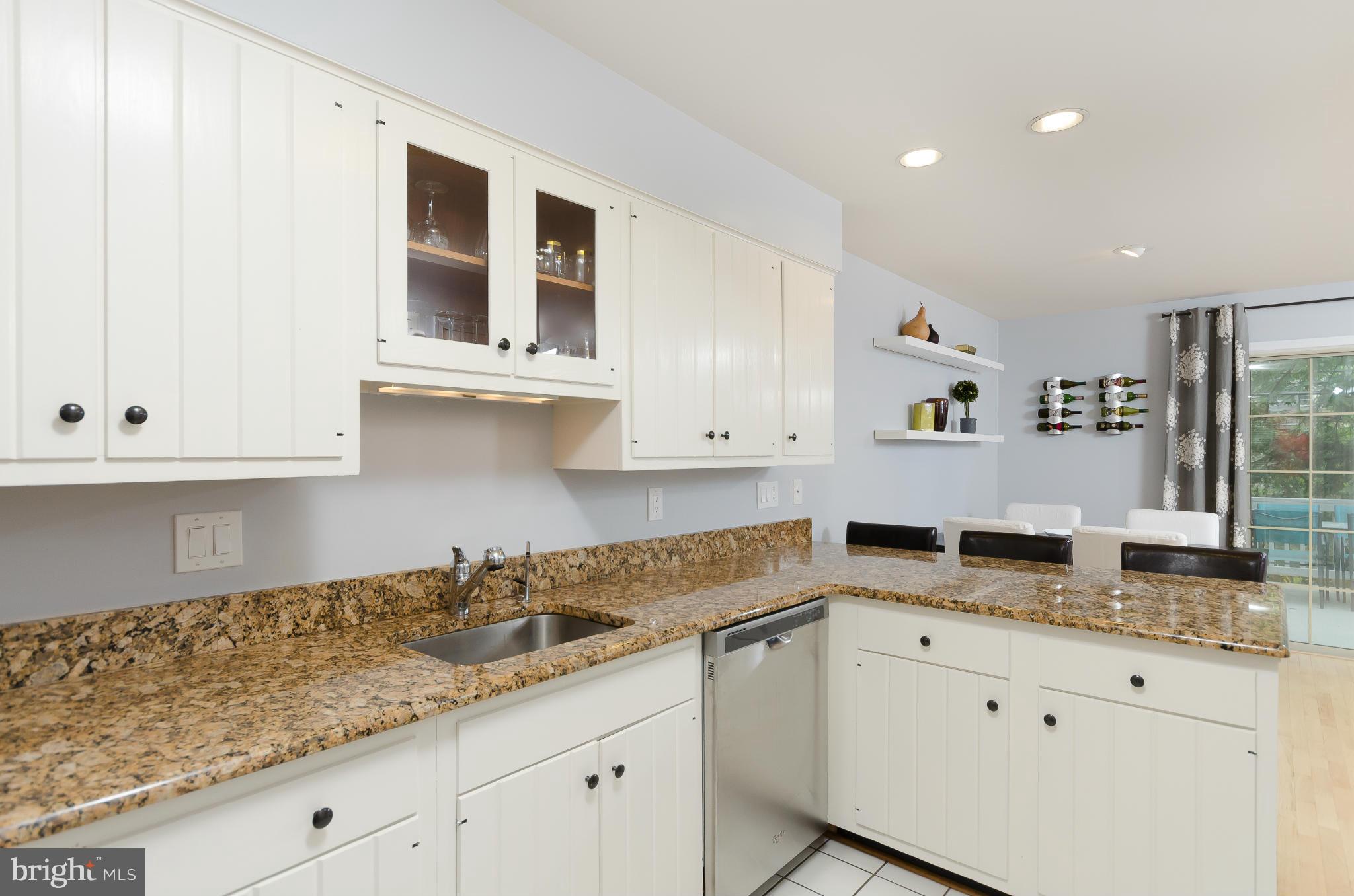 728 West Glebe Road Alexandria, VA 22305 - Photo 5 of 28 a kitchen with granite countertop white cabinets and white appliances