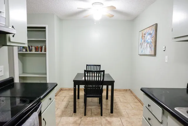 a kitchen with stainless steel appliances granite countertop a sink and a stove