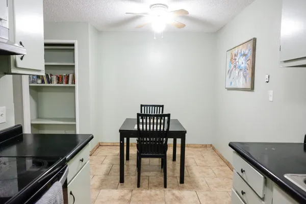 a kitchen with stainless steel appliances granite countertop a sink and a stove