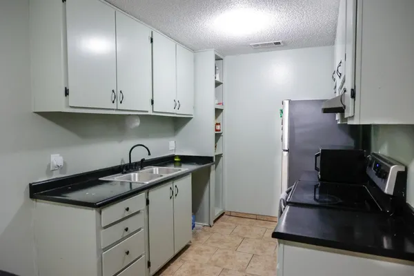 a view of a door and wooden fence