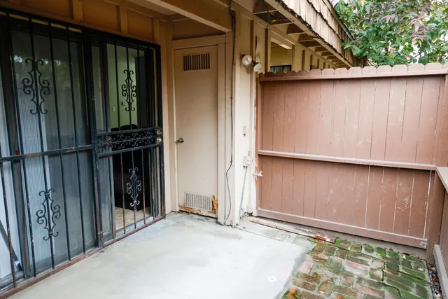 an empty room with wooden floor