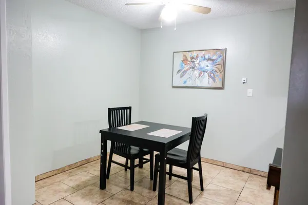 a view of a dining room with furniture
