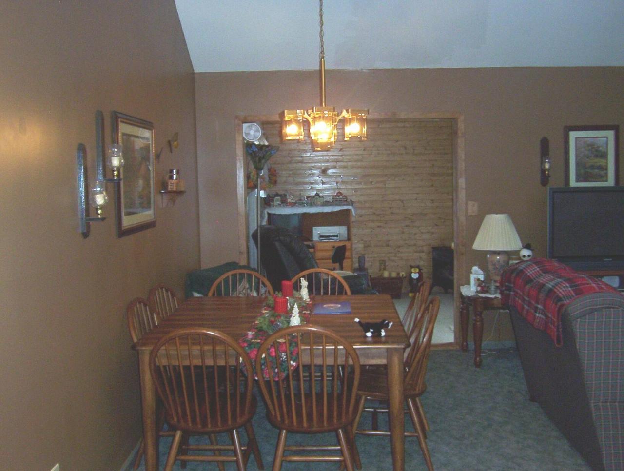 220 Laurel Road Pocono Summit, PA 18346 - Photo 4 of 5 a view of a dining room with furniture and chandelier