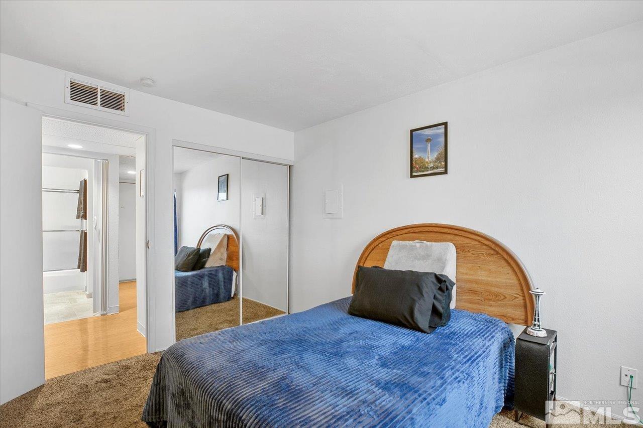 2750 Plumas Street, Unit 219 Reno, NV 89509 - Photo 11 of 22 a bedroom with a bed and a dresser