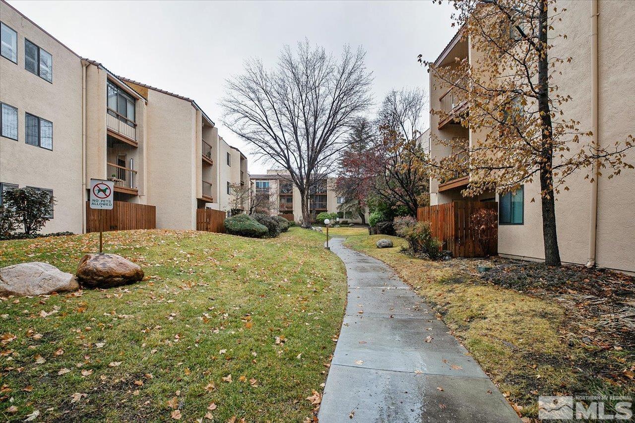 2750 Plumas Street, Unit 219 Reno, NV 89509 - Photo 18 of 22 a view of a yard with a house in the background